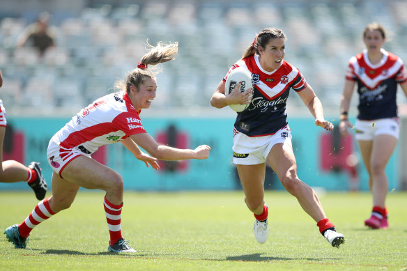 Roosters cross-code star Charlotte Caslick leaves Kezie Apps clutching at air.