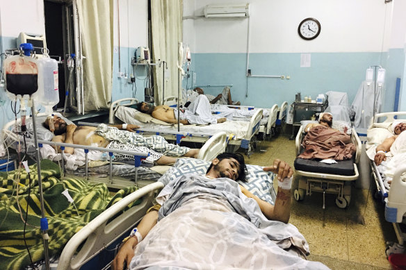 Wounded Afghans from the attacks outside the airport in Kabul.