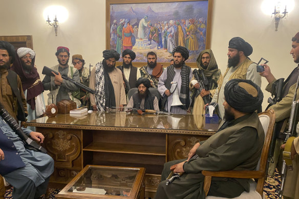 Taliban fighters take control of Afghan presidential palace in Kabul after discovering that Ghani had fled the country. 
