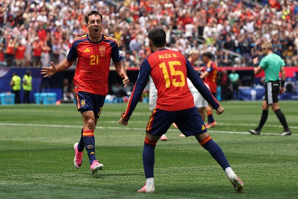Mikel Oyarzabal celebrates with Alex Baena.