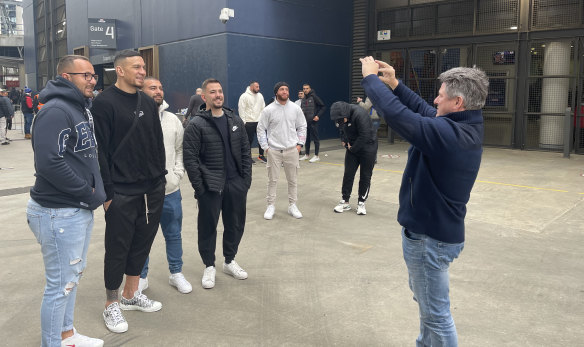 Nine CEO Mike Sneesby takes photos of fans with Sonny Bill Williams.