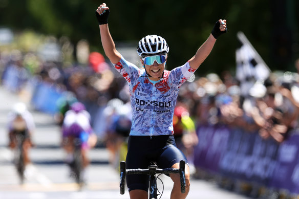 National champion: Nicole Frain celebrates as she crosses the line.
