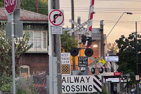 Peak compliance: The Macaulay Road level crossing in Kensington has more than 10 different signs competing for attention.