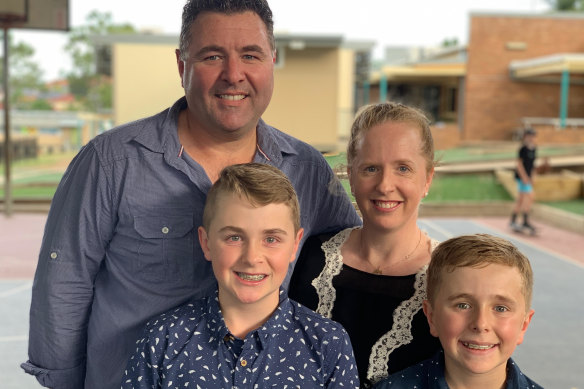 Greg Findlay with wife Sally, with sons Jared (left) and Aaron (right). 