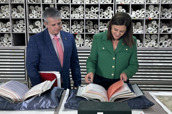 James Cook University law lecturer Anthony Marinac and Queensland Attorney-General Deb Frecklington look over the 1994 Goss government cabinet documents.