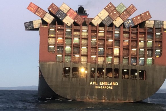 Containers cling precariously to  APL England after other cargo fell overboard in May.
