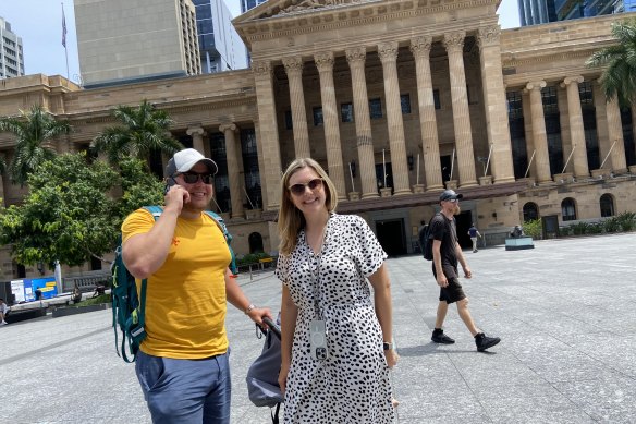 German tourist Lena Herweg (centre) was impressed by City Hall, but less so by the heat radiating up from King George Square.
