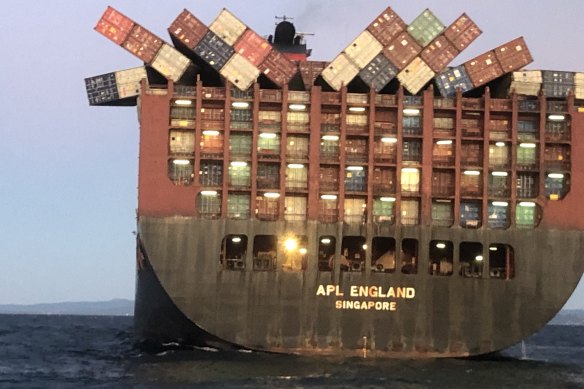 Containers cling precariously to  APL England after other cargo fell overboard in May last year.