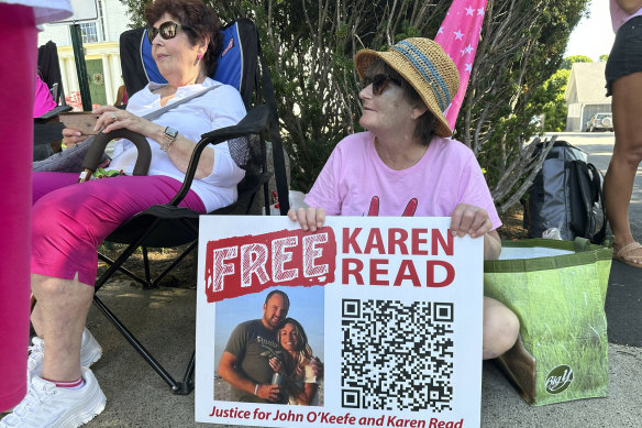 Supporters of Karen Read display signs near court.