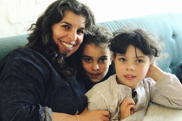 Nicole Azzopardi with her daughters, aged eight and nine.