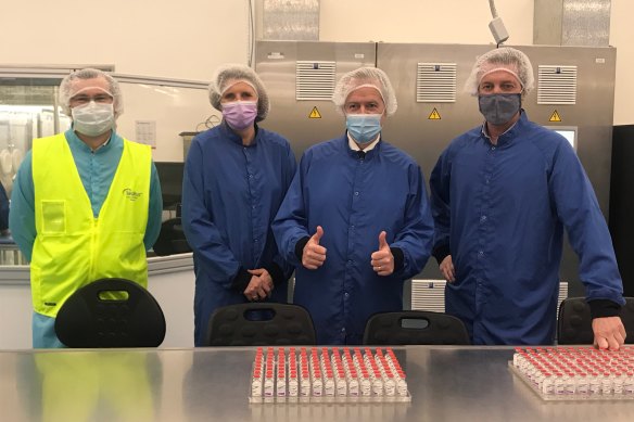 Bill Shorten, second from right, visits the CSL facility producing the AstraZeneca coronavirus vaccine.