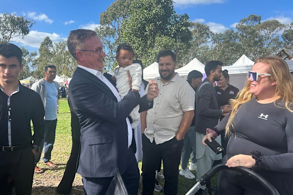 Julian Hill and a baby on the campaign trail.
