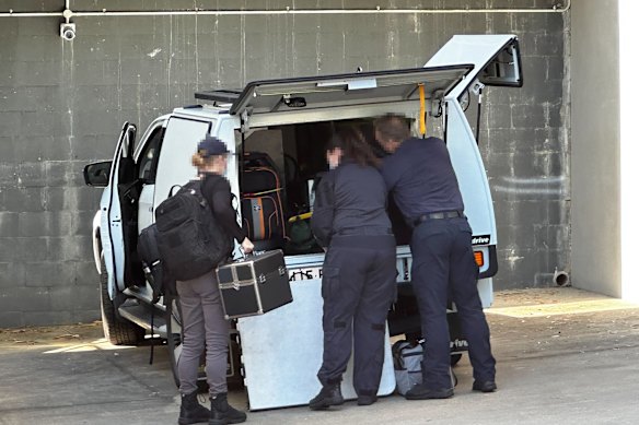Australian Federal Police at the couple’s unit complex in Everton Park, Brisbane.