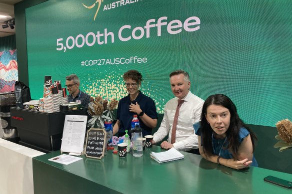 Climate Change and Energy Minister Chris Bowen takes coffee orders at the Australian pavilion at COP27.