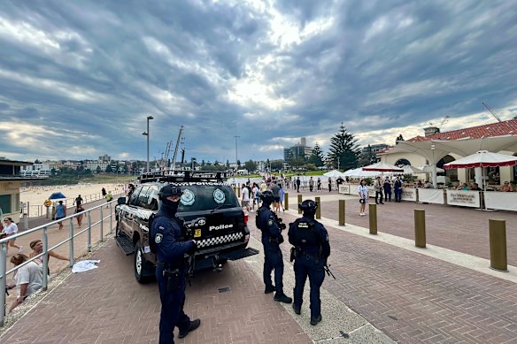 People begin to gather for a candlelight vigil to mark one week after the terror attack in Bondi, with high security.