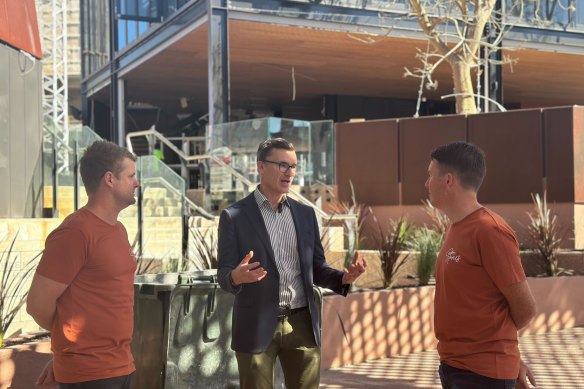 Planning Minister John Carey alongside Nokturnl directors Drew Flanagan and Ross Drennan.