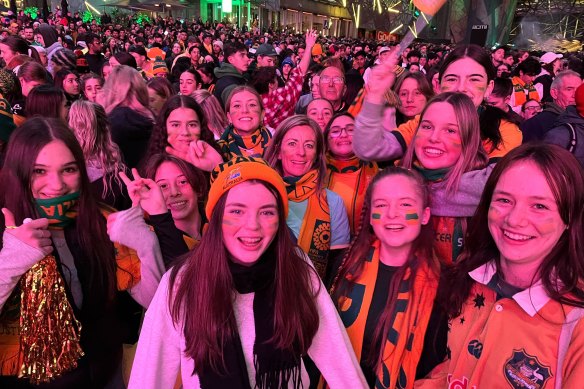 Members of the Williams Landing Football Club watch the Matildas.