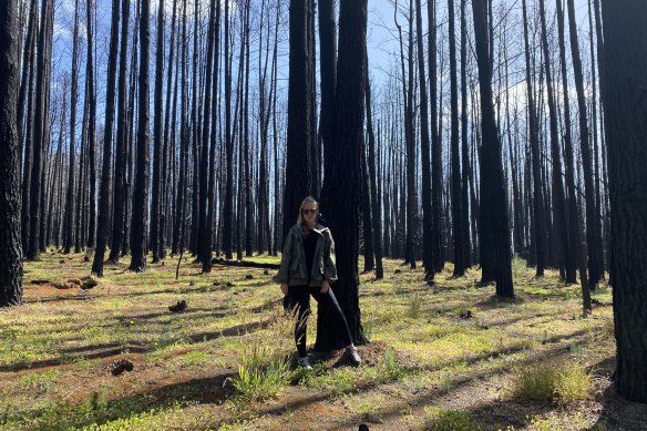 Eva Orner among bushfire-blackened trees.