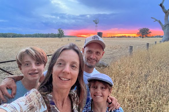 The writer and his family on the farm.