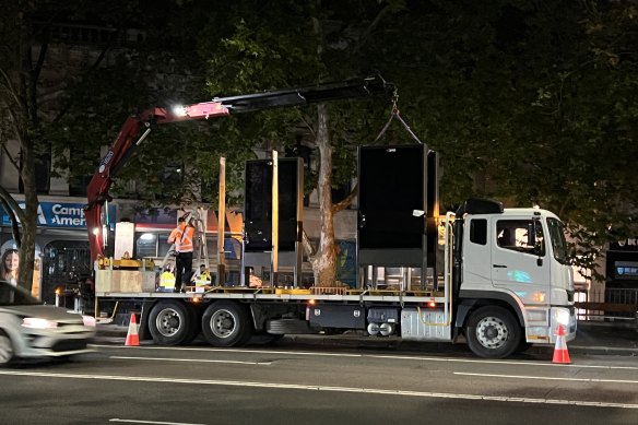 Advertising billboards being installed on Oxford Street on Wednesday night.