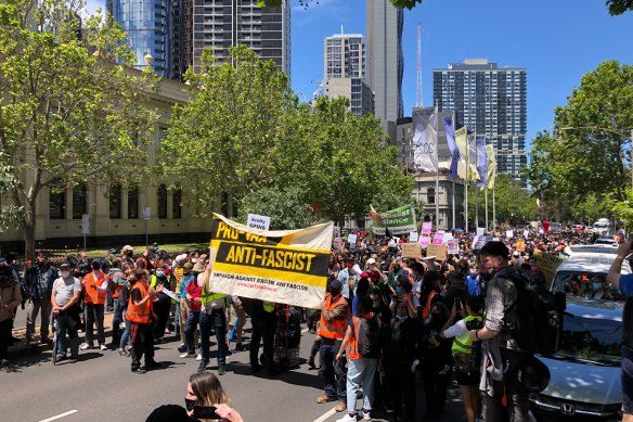 The ‘pro-vax, anti-fascist’ rally in Melbourne moves down Lygon Street on Saturday afternoon.