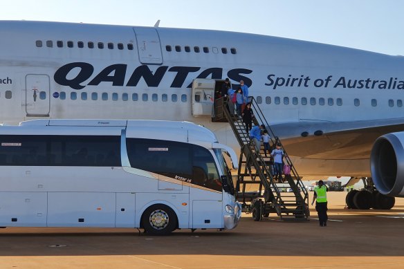 Australians arrive at RAAF Base Learmonth in WA on a Qantas flight from China on February 4.