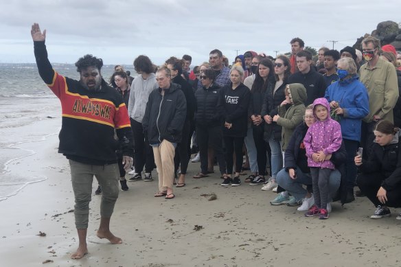 Gunditjmara man Chris Saunders invites those attending the smoking ceremony at the Convincing Ground, near Portland, to remember the spirits of those massacred on the beach.