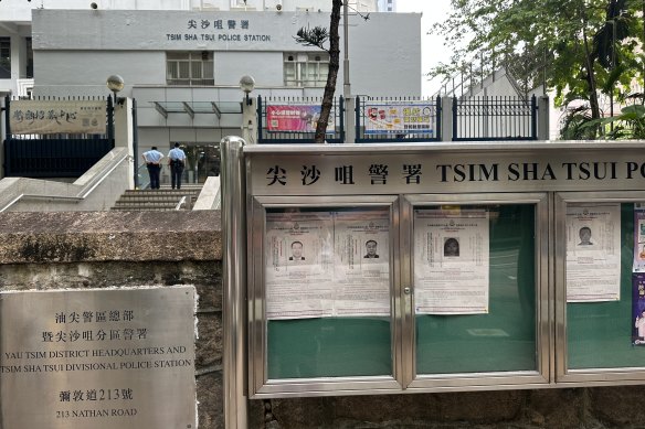 Wanted posters for Kevin Yam, Yuan Gong-yi and Kwok Fung-yee outside Tsim Sha Tsui police station in central Hong Kong. 