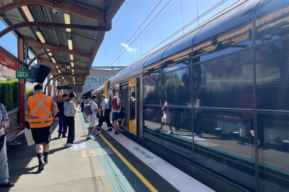 Commuters board a train at Sydenham station on Thursday afternoon.  
