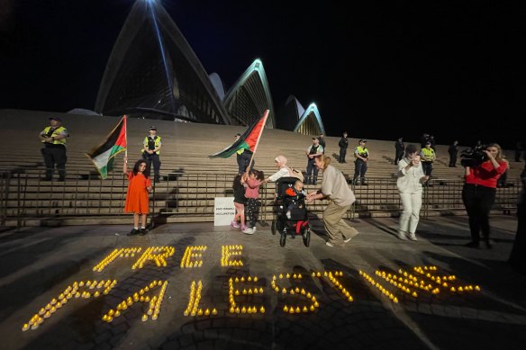 Candles spell out “Free Palestine” on the Opera House forecourt.