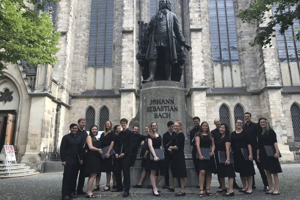 The Australian Chamber Choir pose under the Bach monument in Leipzig on a previous tour.