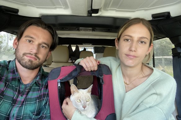 Cameron Reiss, Juliet Brown and Ernie the cat.