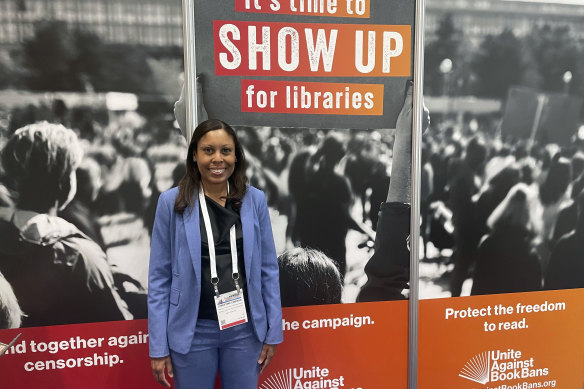 Christine Emeran, director of the Youth Free Expression Program of the National Coalition Against Censorship, a First Amendment advocacy organisation, poses at a Unite Against Book Bans exhibit at the ALA annual conference on June 24.