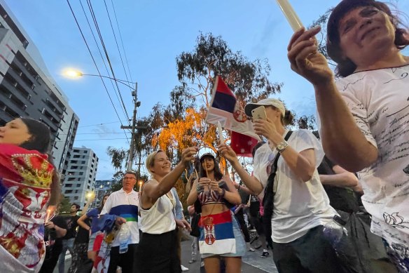 Djokovic fans outside the Park Hotel in Carlton on Thursday. 