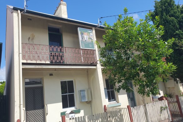 A “for sale” sign outside the properties before they were taken off the market.