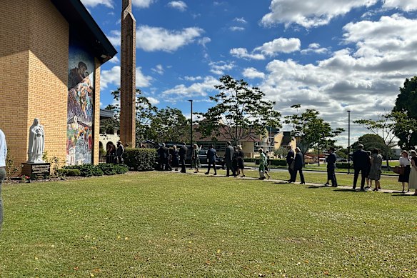 Mourners entering former Stafford MP Jimmy Sullivan’s funeral at Little Flower Church in Kedron on Wednesday.