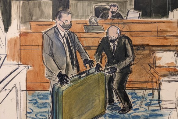 In this sketch, a prosecution detective, left, shows a massage table recovered from Jeffrey Epstein’s Palm Beach Beach home to witness and former Palm Beach Police Officer Gregory Parkinson, right, during testimony in the sex-abuse trial of Ghislaine Maxwell, Friday Dec. 3, 2021, in New York. 