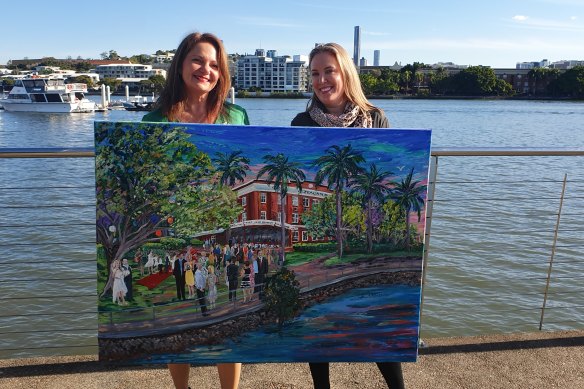 Artist Donna Gibb (left) with Cressida Ward holding her wedding painting.