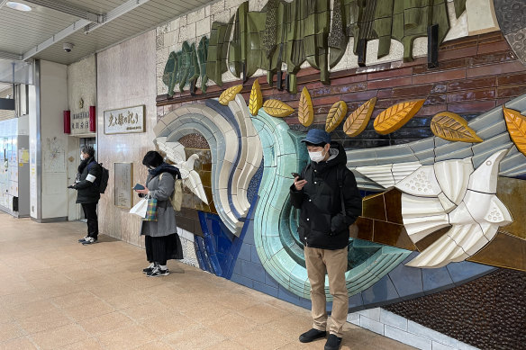 Shoji Morimoto, 38, known as Japan’s “do-nothing guy,” waits for his client at a subway station outside Tokyo. 