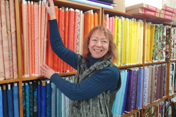 Joy Bolte checks her fabric supplies