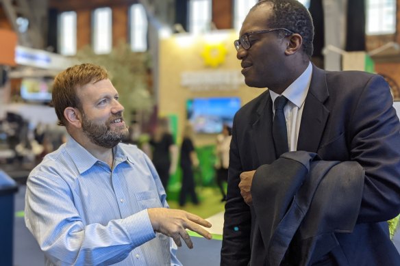 US pollster Frank Luntz speaks to British cabinet minister Kwasi Kwarteng at the Conservative Party conference in Manchester.