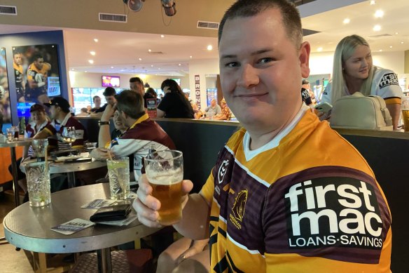 Young Broncos fan Terry Butler from Inala tips a four-point win over the Panthers.