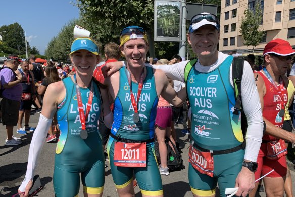 With colleagues Professor Georgina Long and Dr Robert Rawson at the World Triathlon Championships in Lausanne, Switzerland, in 2019.