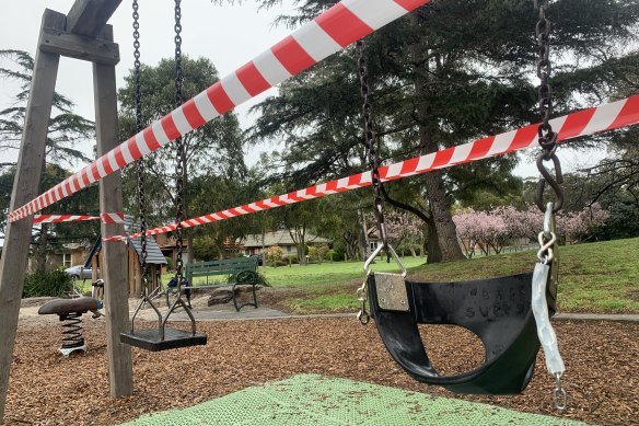 Tape blocks off access to swings at Basterfield Park in Hampton East on Tuesday, as stricter COVID-19 restrictions came into effect in Melbourne.