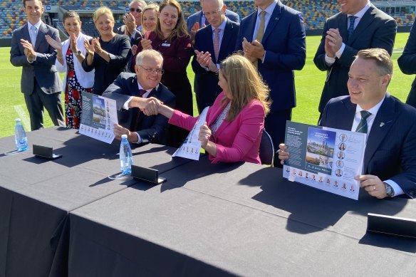 Prime Minister Scott Morrison, Queensland Premier Annastacia Palaszczuk and Brisbane lord mayor Adrian Schrinner signing the SEQ City Deal at the Gabba in March 2022.