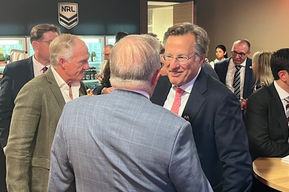 New US ambassador David Brat with Anthony Albanese inside the Presidents Suite at Accor Stadium on Sunday night for the NRL grand final. Greg Norman is in the background.