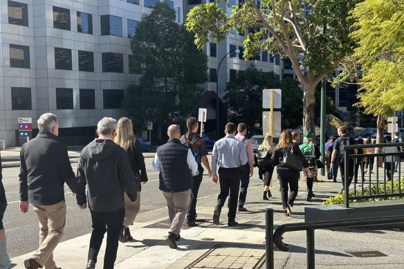 Woodside staff returning to the company’s headquarters almost two hours after the evacuation.