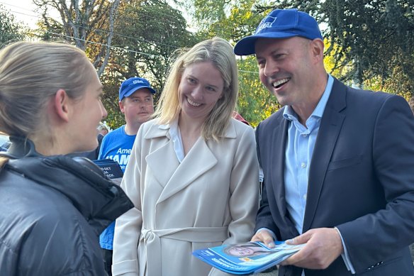 Josh Frydenberg and Amelia Hamer with a pre-poll voter in Malvern.