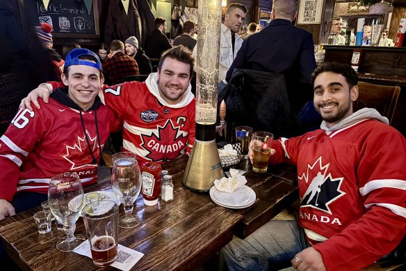 Canadian hockey fans Tevi Mandel, Matt Holland and Ashkon Noori from Toronto at McLean’s Pub.