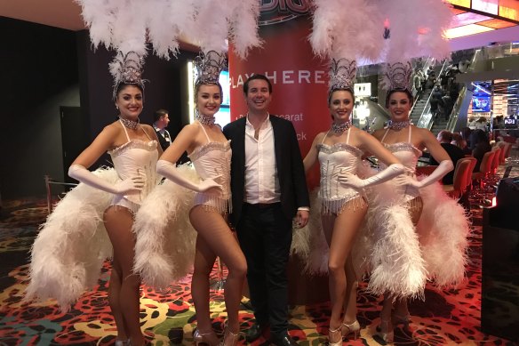 Tim Alford with showgirls at the Crown casino in Melbourne in 2018.